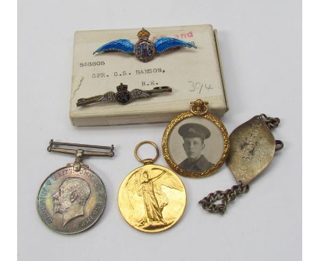 A WWI pair of medals to 548805 SPR.C.S. HANSON R.E. together with silver identity tag, associated photo portrait fob and issu