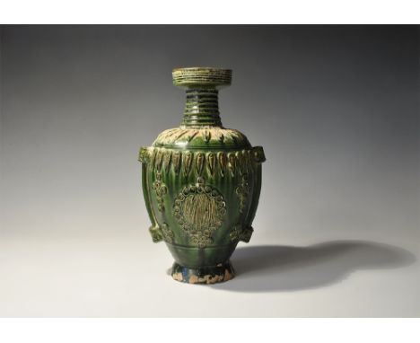 An undated archaistic green-glazed ceramic vase with flared base, bulbous body, deep shoulder, ribbed neck and socket rim; th