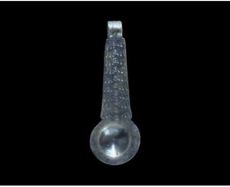 10th - 11th century AD. A silver pendant in the form of a ladle or strainer, with wide bowl and handle with double row of das