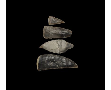 Group comprising: archaistic Neolithic style implements being a triangular arrowhead; a bifacial, leaf-shaped spearhead with 