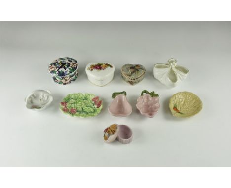 20th century AD. A group of decorative ceramic items comprising: four lidded trinket boxes; two small bowls formed as grapes 