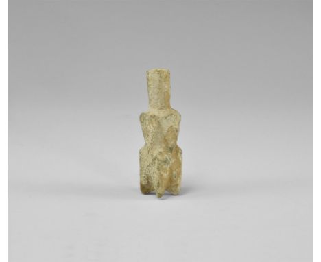 9th-11th century AD. A glass molar flask with faceted body and octagonal-section neck, four tapering feet to the underside. F