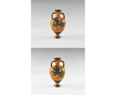 20th century AD. A ceramic miniature amphora with flared base, narrow neck, flared rim, two lateral strap handle, painted ima