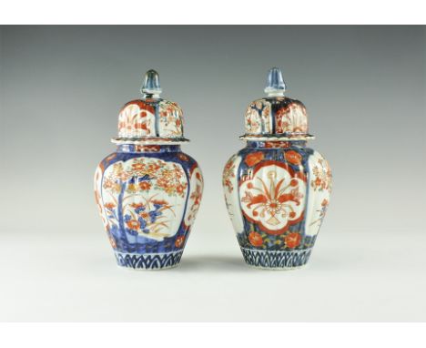 Late 19th-early 20th century AD. A matched pair of ceramic Imari ware jars with ribbed bodies and bell-shaped lids, each deco