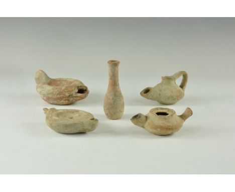 2nd-4th century AD. A mixed group of terracotta items comprising: two flat discoid lamps with lug handles to the rear; a disc