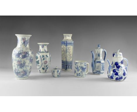 20th century AD. A mixed group of white-glazed ceramics with blue ornaments comprising: a tall vase with hand-painted fish; a