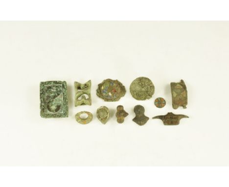 1st century BC-1st century AD. A mixed group of bronze items comprising:a rectangular slider with S-scrolled motif, two loops