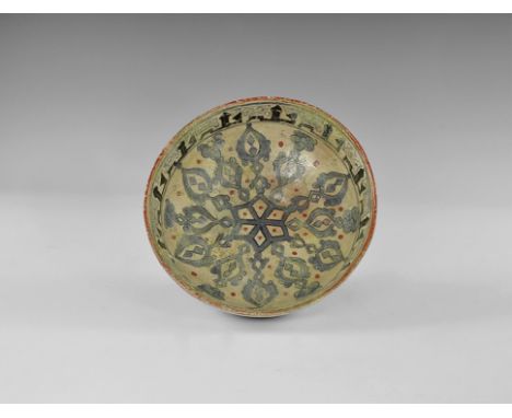 20th century AD. A creamware ceramic bowl with flared foot, vertical rim with bands of calligraphic text to both faces, centr