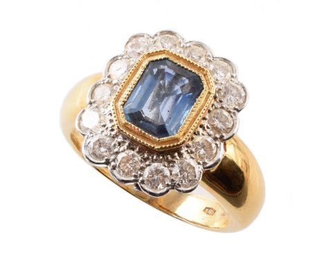 Sapphire and diamond cushion shaped 18ct gold ring , central rectangular cut cornered blue sapphire weighing approximately 1.