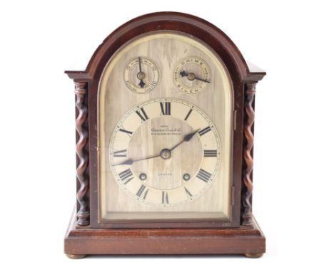 An early 20th century mantle clock by Camerer Cuss &amp; Co. London (54 &amp; 56 Oxford St). The mahogany case has rounded ar