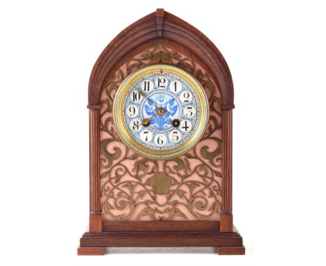 A 19th century mantle clock by Henri Marc of Paris. The oak case has lancet arch with stepped pediment framing a fretwork fro