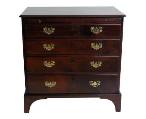 George III mahogany chest of four long graduated drawers, fitted brushing slide, replacement brass handles, standing on four 
