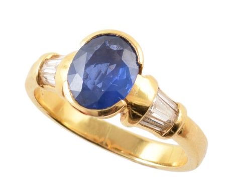 Sapphire single stone 18ct yellow gold ring with diamond set shoulders , central oval brilliant cut sapphire measuring approx