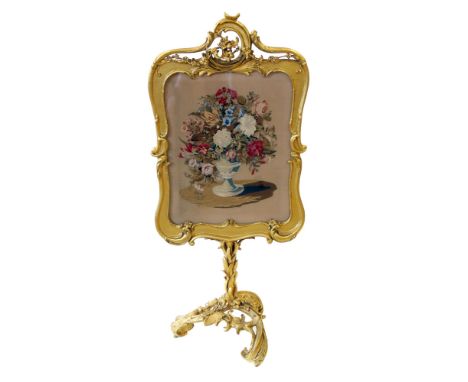 Victorian gesso fire-screen, rectangular frame supporting needlepoint tapestry depicting flowers in urn, mounted on single co