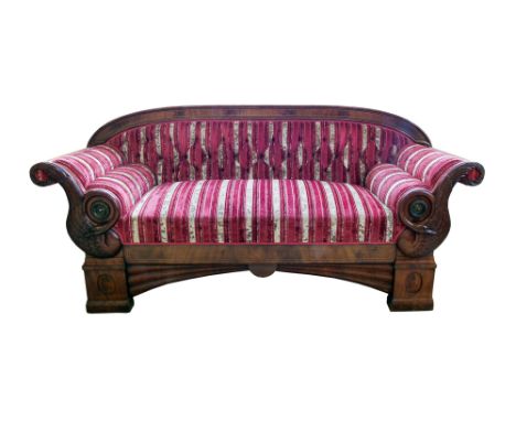 19th century Biedermeier style sofa, arched back with figured mahogany veneers, scrolling arms decorated with carvings of swa