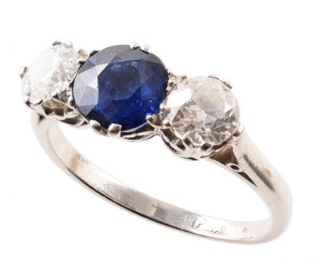 Sapphire and diamond three-stone platinum ring , central round brilliant cut sapphire measuring approx. 6mm diameter, 2 round