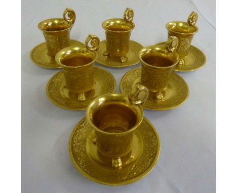 Six gilded porcelain coffee cups and saucers