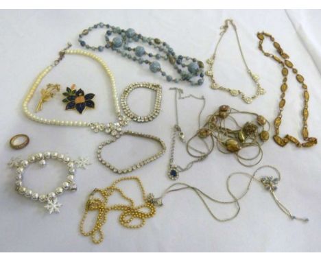 A quantity of costume jewellery to include necklaces, a ring and a bracelet