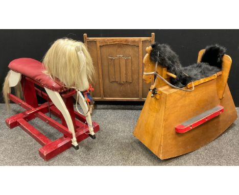 A mid 20th century painted wooden rocking horse, 84cm high x 115cm x 50cm;  another rocking horse, with storage compartment; 