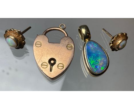 A 9ct gold black opal pendant, irregular opal with blue, green and violet colour, pair of white opal stud earrings, 9ct gold 