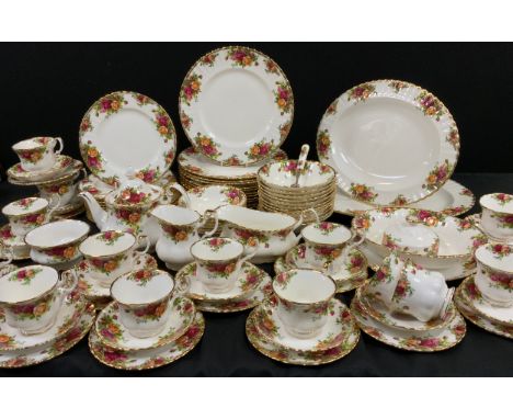 A Royal Albert ‘Old Country roses’ table service for twelve including; a tea pot, milk jug, sugar bowl, twelve tea cups and s