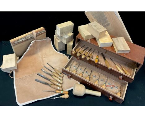 A set of wood-carving tools, including Ashley Iles Blockcutters / palm chisels - curved gouge (various sizes), straight gouge