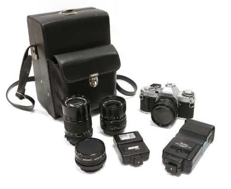 Canon AV1 Camera with FD lenses: f1.8 50mm, f3.5 135mm and f3.5-4.5 35-70mm; in fitted caseCanot operate shutter; 50mm: apper