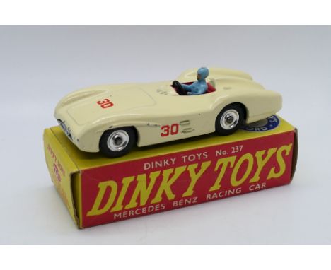 Dinky - A boxed Mercedes Benz racing car with spun hubs # 237. The car appears in Very Good condition with some small paint c