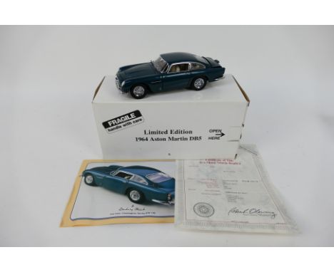 Danbury Mint - A boxed Limited Edition Danbury Mint 1:24 scale 1964 Aston Martin DB5 . The model in Aegean Blue model is one 