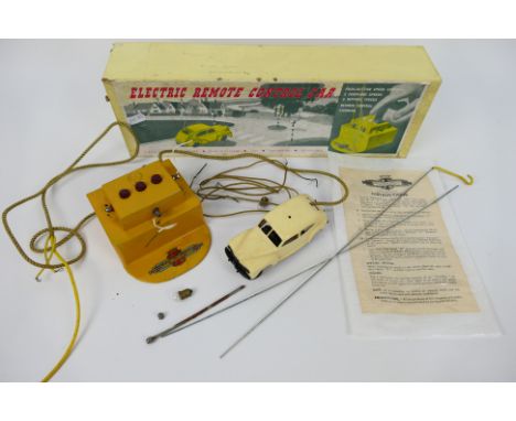 Nulli Secundus - A boxed Electric Remote Control Car set by Nulli Secundus. The vintage set with cream saloon car appears to 