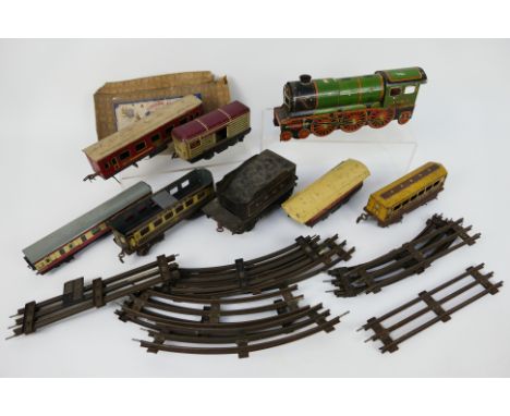 Wells Brimtoy - Bing - A Wells Brimtoy tinplate O gauge clockwork train with a group of Wells Brimtoy carriages and a Bing 'L