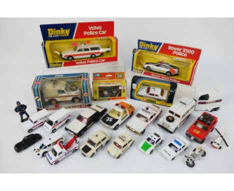 Corgi - Britains - Dinky - Matchbox - Others - Five boxed diecast Police vehicles with a group of unboxed police and emergenc