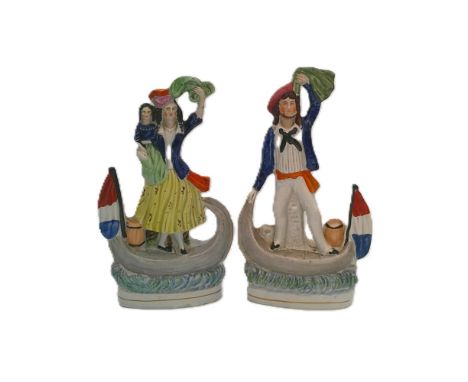 A rare pair of Staffordshire portrait figures of a sailor (jack tar) and his lady companion and child, both standing in boats