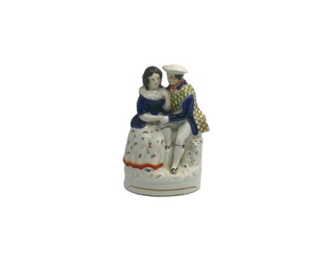 A Staffordshire portrait figure of Burns and Mary, both seated, Burns with his right arm on Mary’s shoulder and left holding 