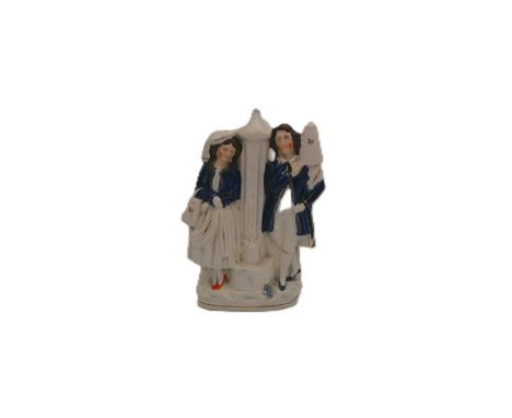 A rare Staffordshire Dudson portrait figure of a boy and girl at a water fountain. Water Carriers he with a jug on his should