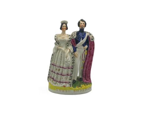 A Staffordshire portrait figure of Queen Victoria and Emperor Napoleon Bonaparte III, standing side by side on a gilt lined b