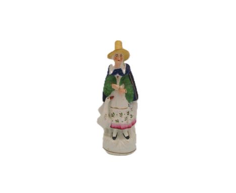 A Staffordshire porcelaneous portrait figure of Mother Goose.  Circa 1850. Size 18cm high  Condition.  A few scuffs, otherwis