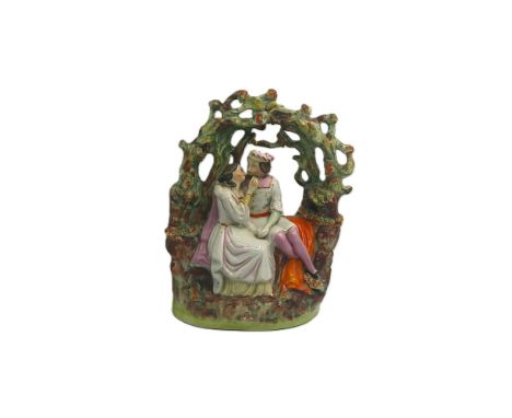 A Staffordshire Thomas Parr portrait group figure of Jessica and Lorenzo seated in an arbour, from the play The Merchant of V
