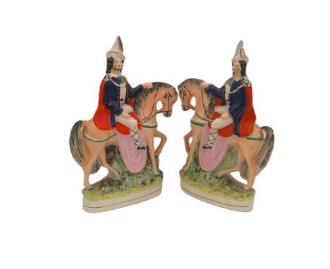 A pair of Staffordshire portrait figures of Tyrolean Brigands on horseback.  Circa 1850. Size. 36cm high  Condition. Crack to
