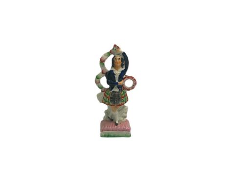 A Staffordshire portrait figure of a dancer in Scottish attire, holding a flower hoop at her waist. Circa 1855   size 22cm hi