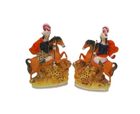 A pair of Staffordshire portrait figures of Leopard Slayers on horseback.  Circa 1850.  Size. 28cm high Condition. Right faci