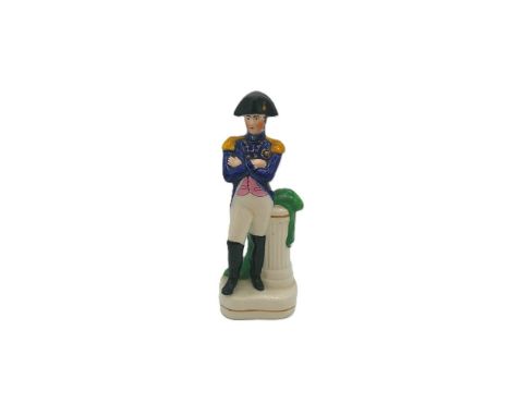 A Staffordshire portrait figure of Napoleon, standing with his arms crossed leaning against a pillar  Circa 1845   size 18.5c