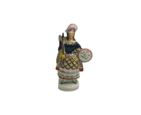 A Staffordshire portrait figure of Sara Egerton, in the role of Helen Macgregor, holding an axe and a shield Circa 1848   siz