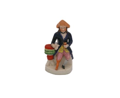 Staffordshire portrait figure of a Sailor, seated with his right arm resting on a table and holding a jug and a mug in his le