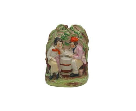 A Staffordshire Thomas Parr Crimean War portrait figure of two men seated around a barrel reading a newspaper Circa 1860 size