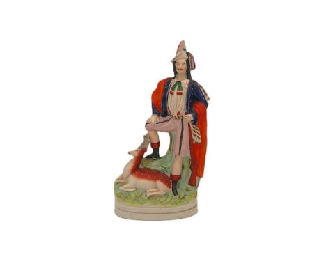 A Staffordshire portrait figure of a Hunter and a stag.  Circa 1848.  Size 33cm high  Condition. Nibbles to foot rim, some cr