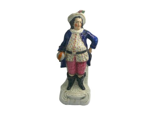 A Large Staffordshire portrait figure of Falstaff, standing on a gilt lined rococo base. Titled FALSTAFF in raised gold capit