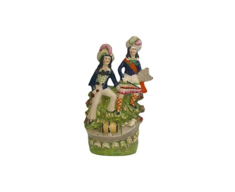 A Staffordshire portrait figure of a man and a woman standing on a rocky mound, with a boat in front holding a barrel, possib