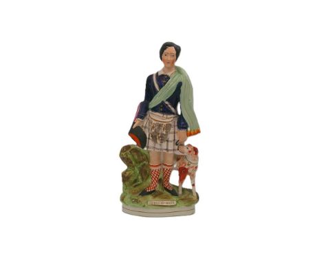 A Staffordshire portrait figure of The Prince of Wales, dressed in Scottish attire, with his dog standing alongside. Titled. 