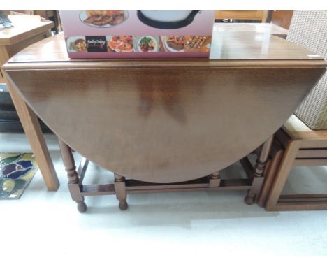 A mahogany gate leg dining table